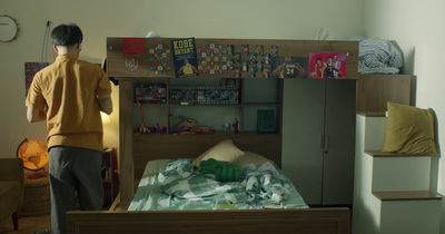 a man standing in front of a bunk bed