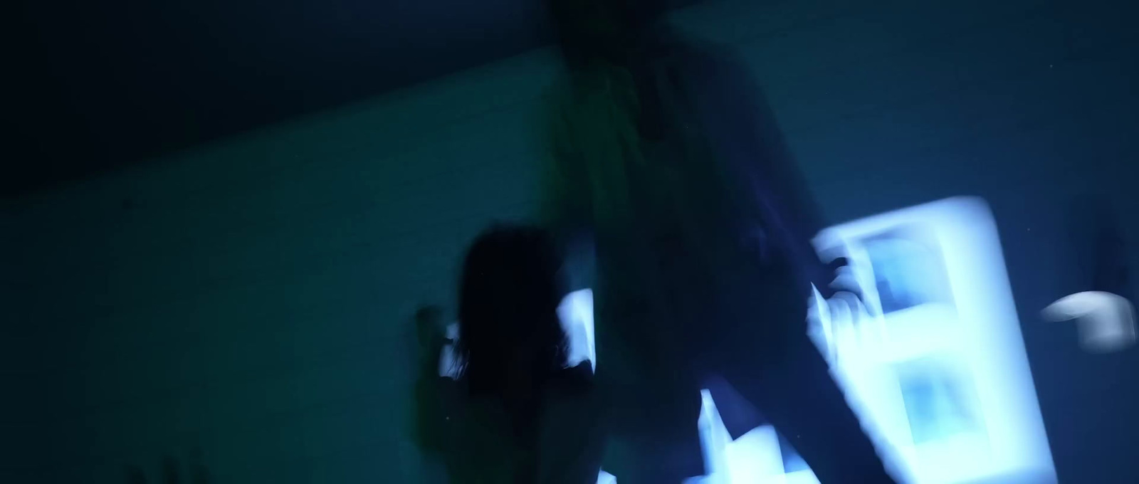 a blurry image of a person standing in a room