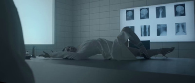 a person laying on a counter in a room