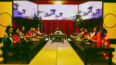 a group of women sitting at a long table