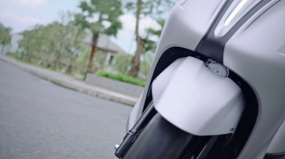 a close up of a motorcycle parked on the side of the road