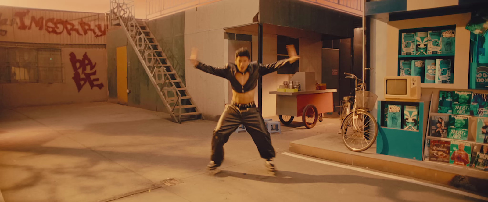 a man standing on top of a skateboard in front of a building