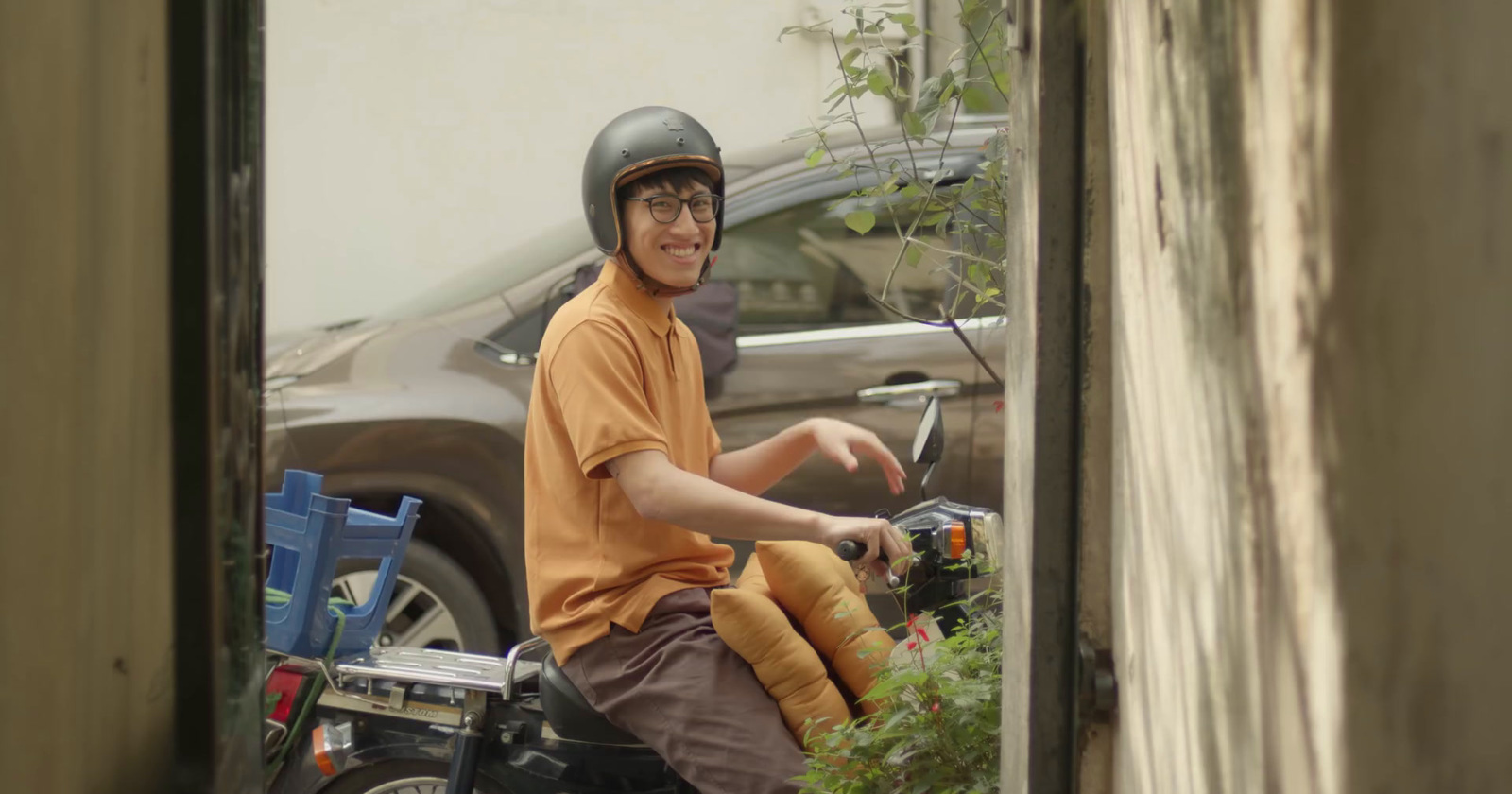 a man riding a motorcycle down a street