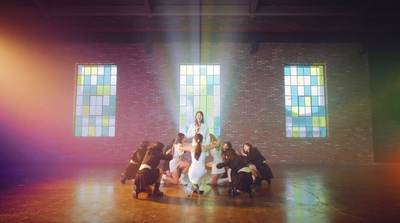 a group of people standing on top of a stage