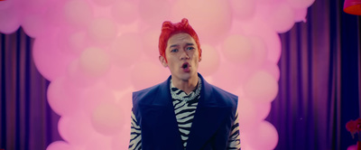 a man with red hair is making a funny face