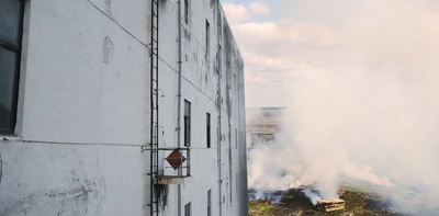 a building with a lot of smoke coming out of it