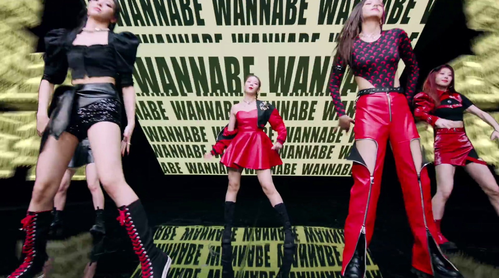 a group of women standing on top of a stage