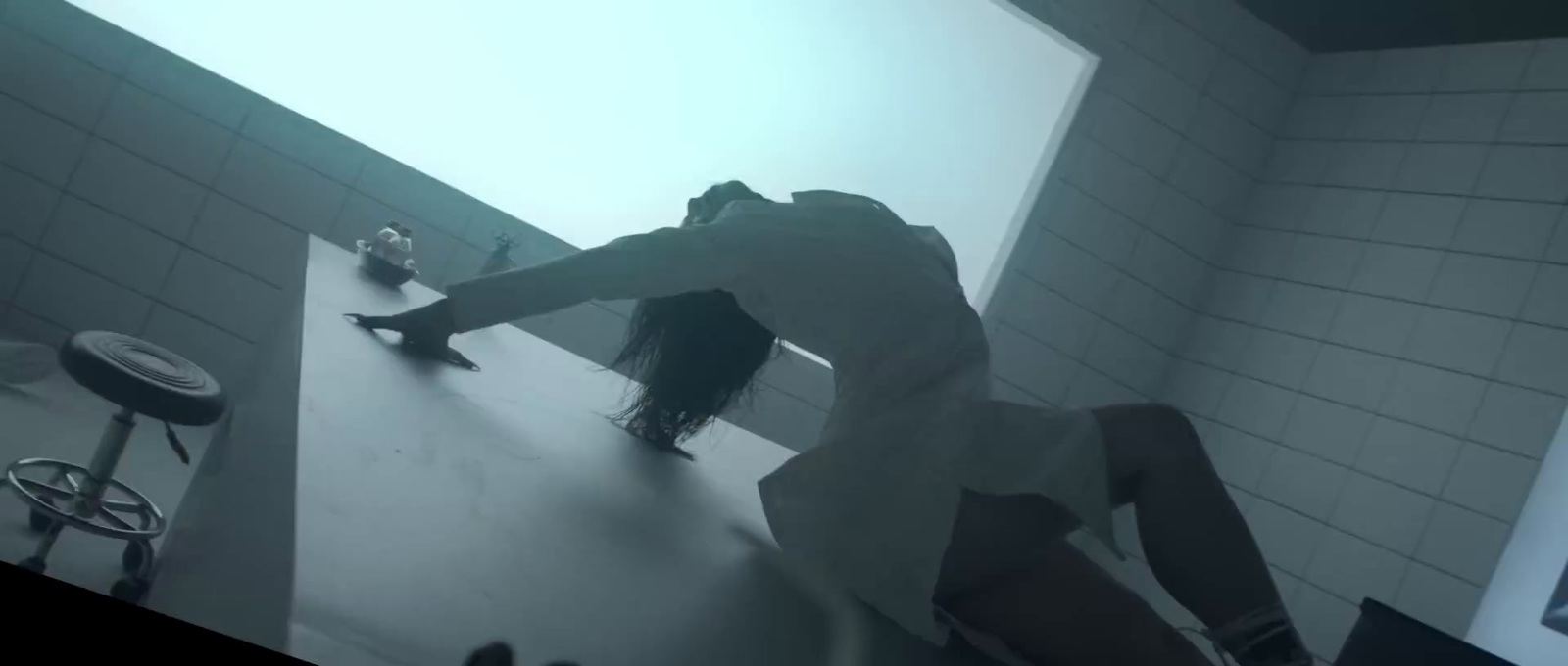 a woman standing on a counter in a bathroom