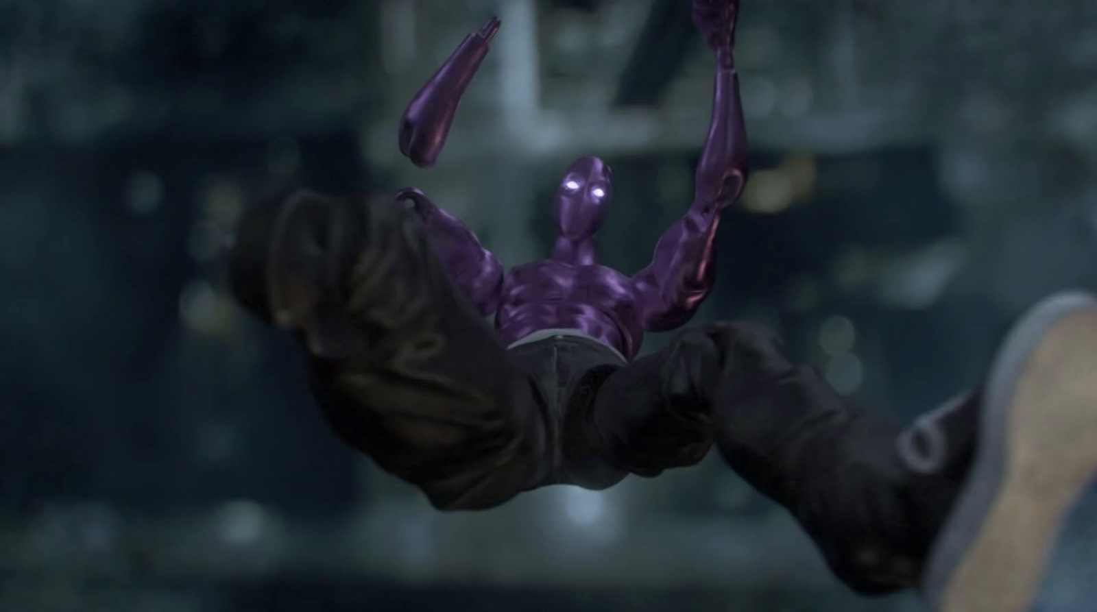 a man in a purple suit is holding out his hands