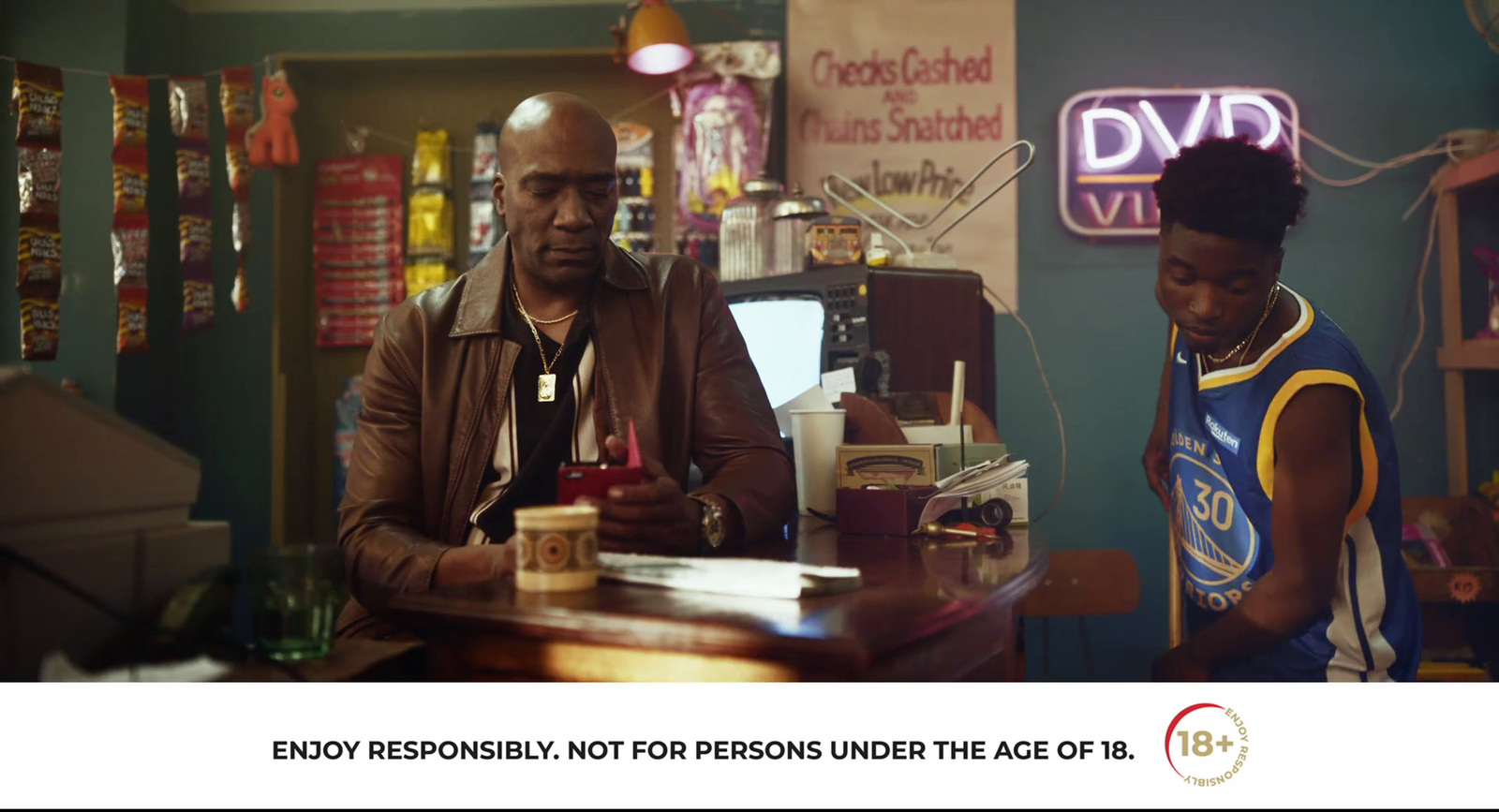 a man and a woman sitting at a bar