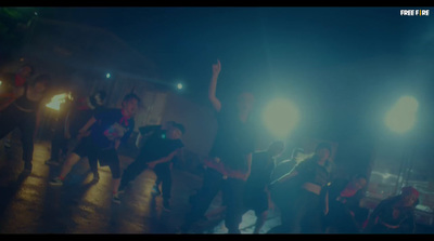 a group of people standing on top of a dance floor