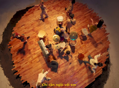 a group of people standing on top of a wooden floor