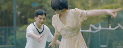 a man and a woman playing tennis on a court