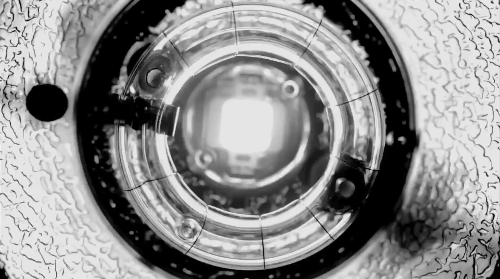 a black and white photo of the inside of a washing machine