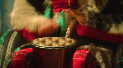 a person sitting down with a cup of coffee