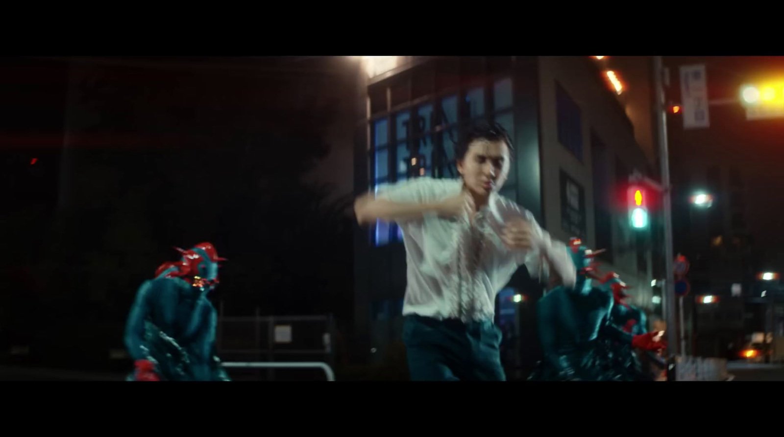 a man in a white shirt is dancing in the street