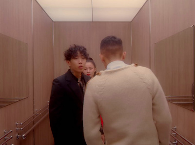 a group of men standing in a bathroom next to each other