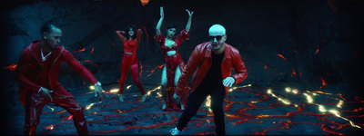 a group of people dressed in red dancing