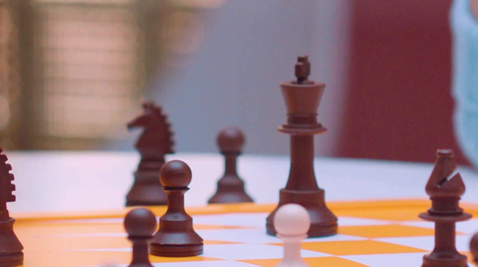 a close up of a chess board with pieces on it