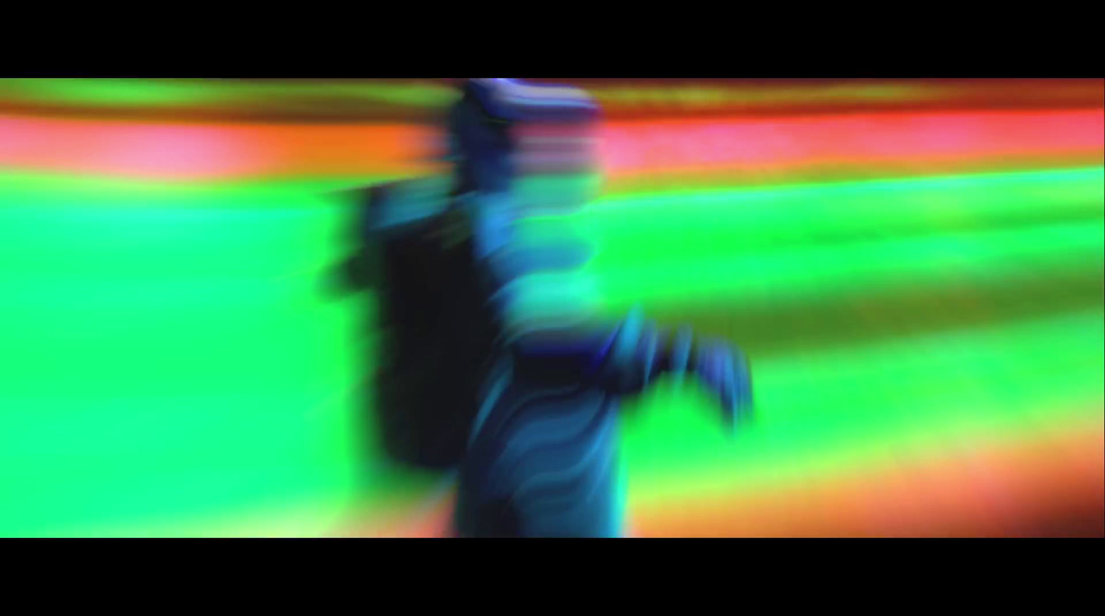 a blurry image of a person standing in a baseball field