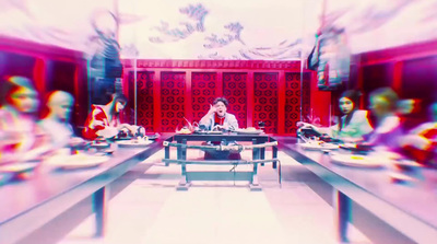 a blurry photo of a person sitting at a table