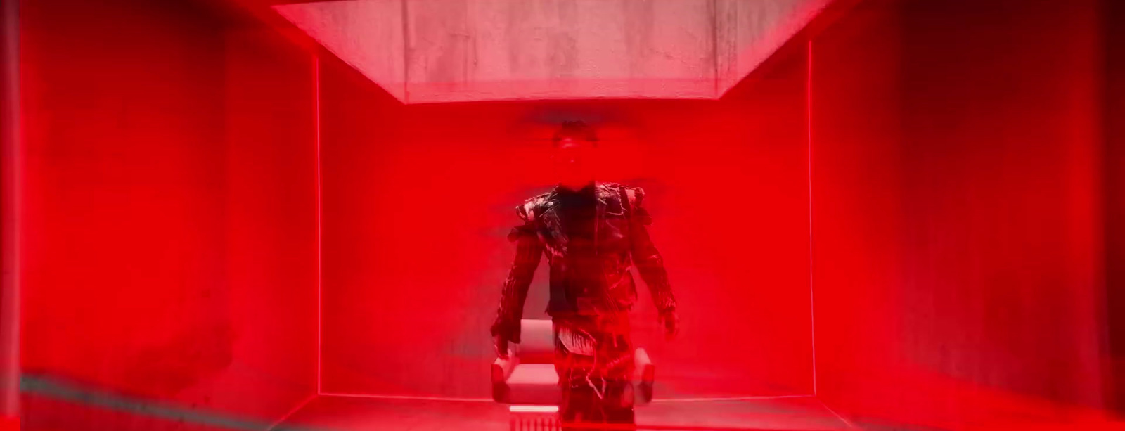 a robot is standing in a red room