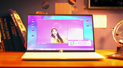 a laptop computer sitting on top of a wooden desk