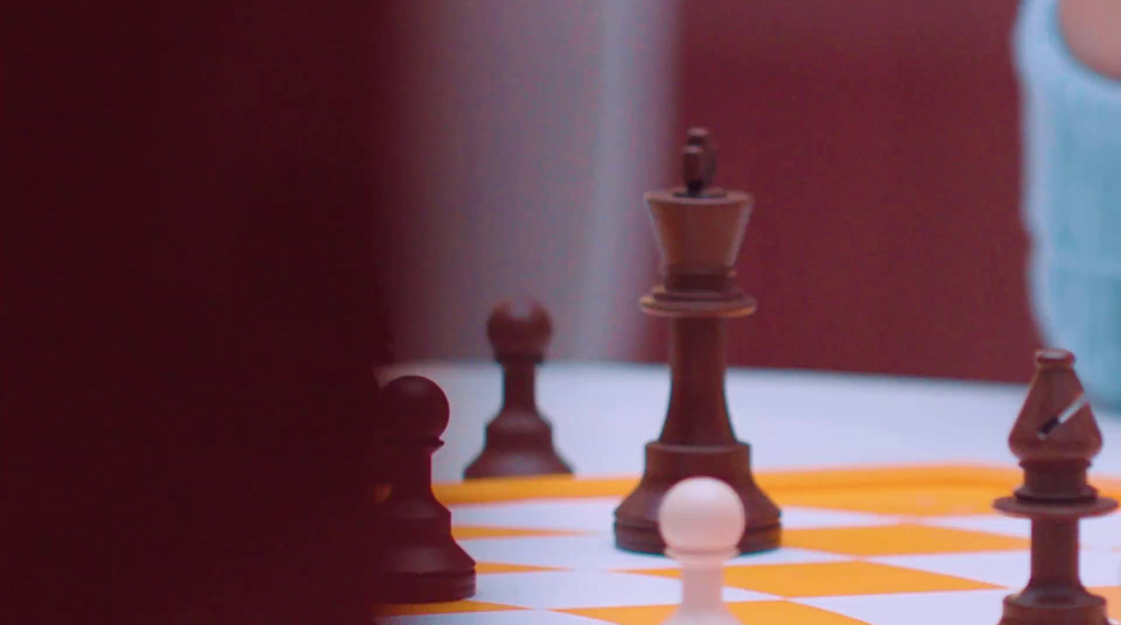 a close up of a chess board with pieces on it