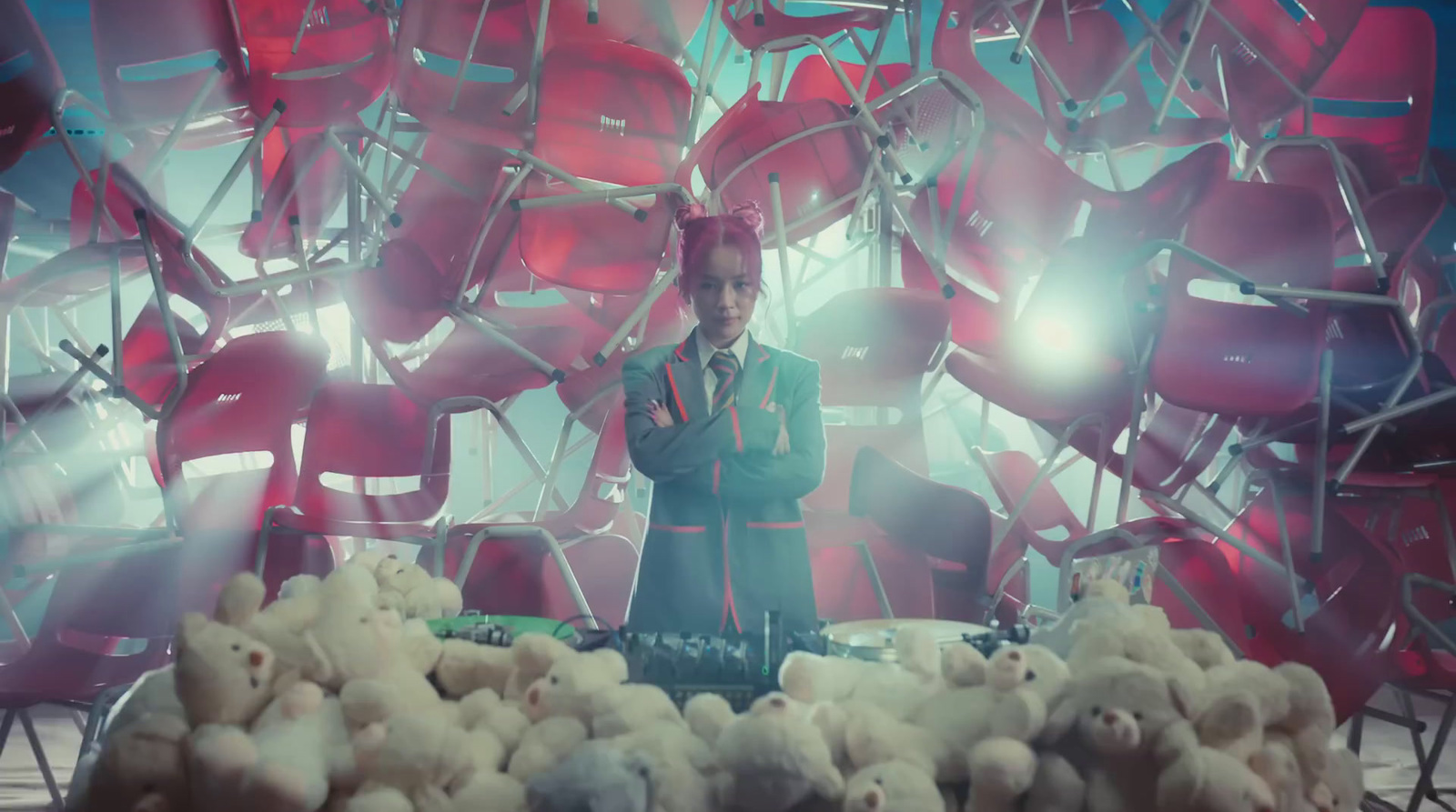 a man standing in front of a bunch of stuffed animals