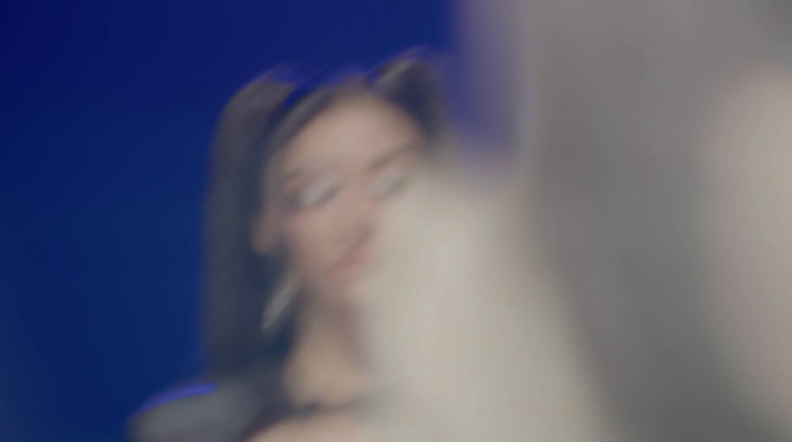 a blurry photo of a woman talking on a cell phone