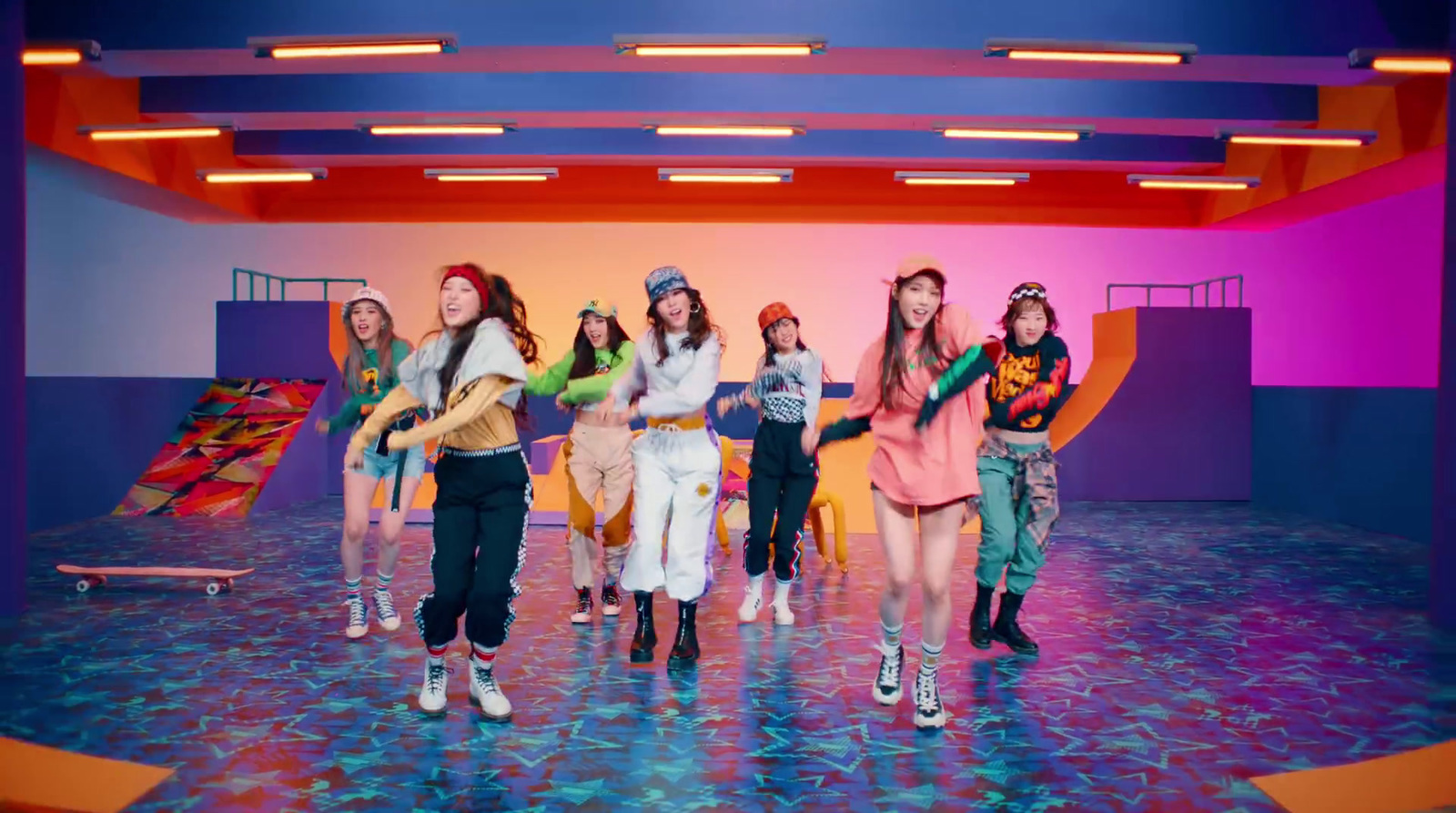 a group of young women standing on top of a stage