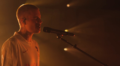 a man standing in front of a microphone