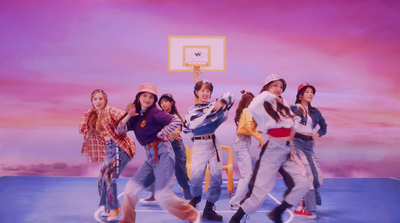 a group of young people standing on top of a basketball court