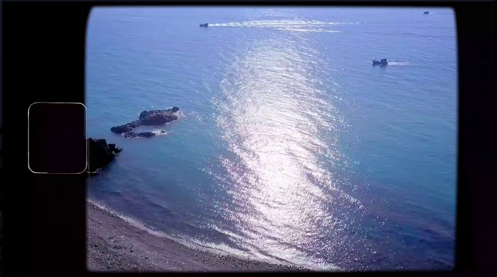 an aerial view of a boat in the water