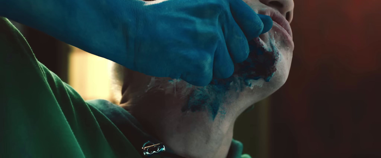 a close up of a person wearing blue gloves