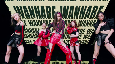 a group of women standing on top of a stage