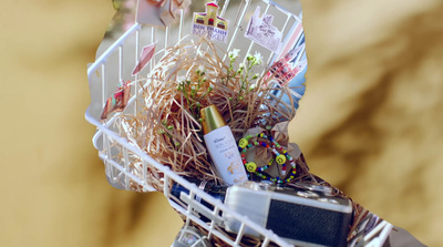 a white basket filled with lots of different items