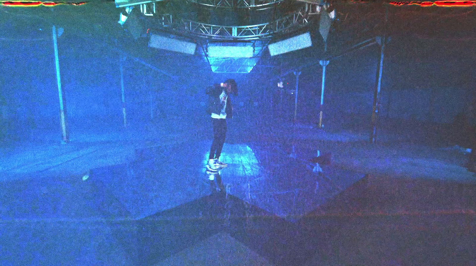 a man riding a skateboard on top of a stage