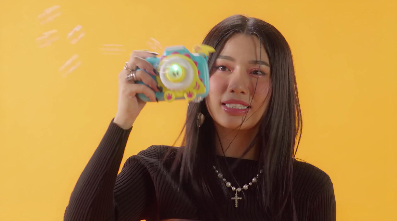 a woman holding a toy in front of her face