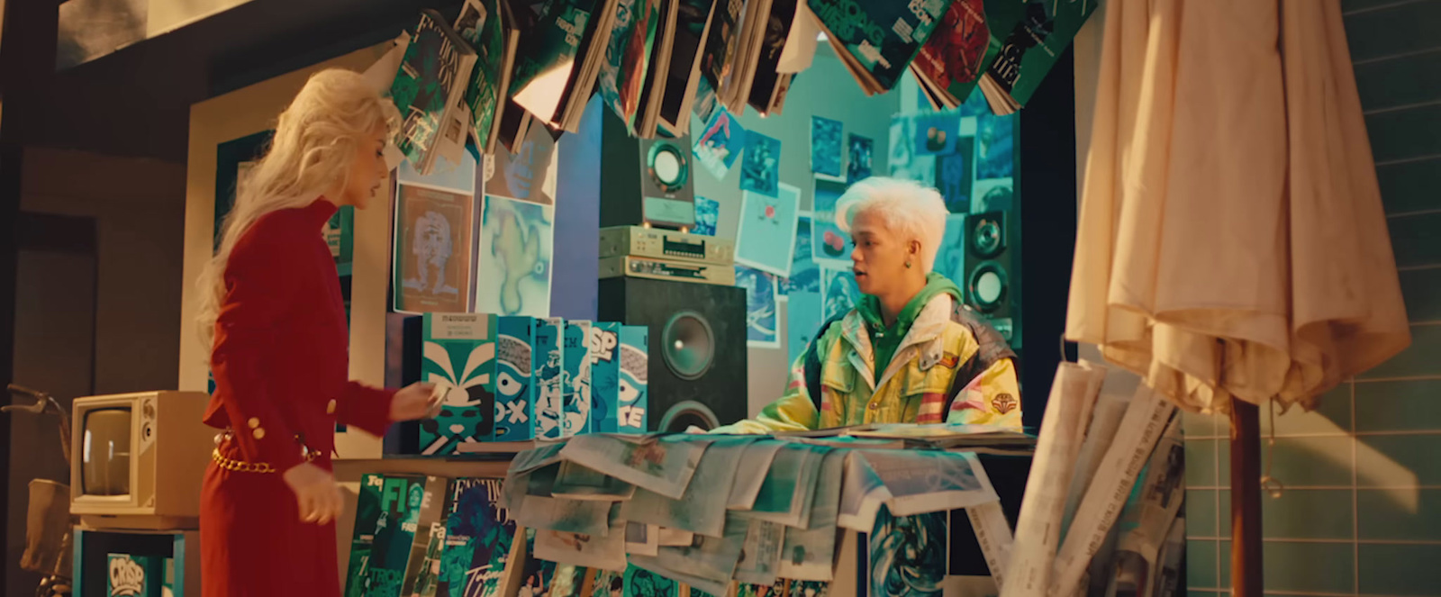 a woman standing in front of a display of items