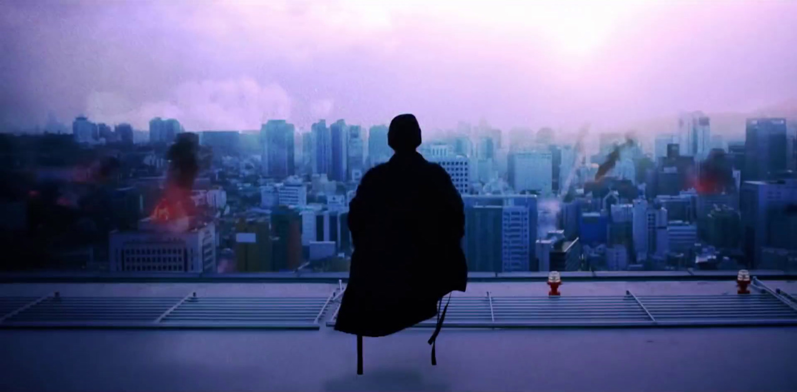 a man standing in front of a city skyline