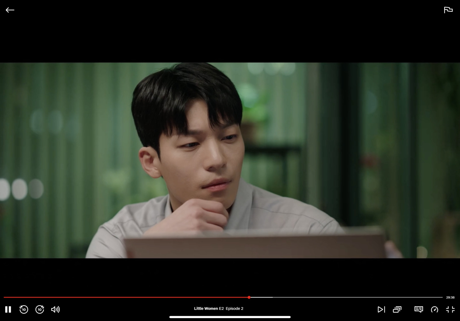 a man sitting in front of a laptop computer