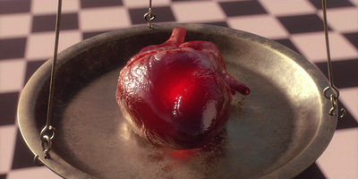 a heart in a pan on a checkered floor