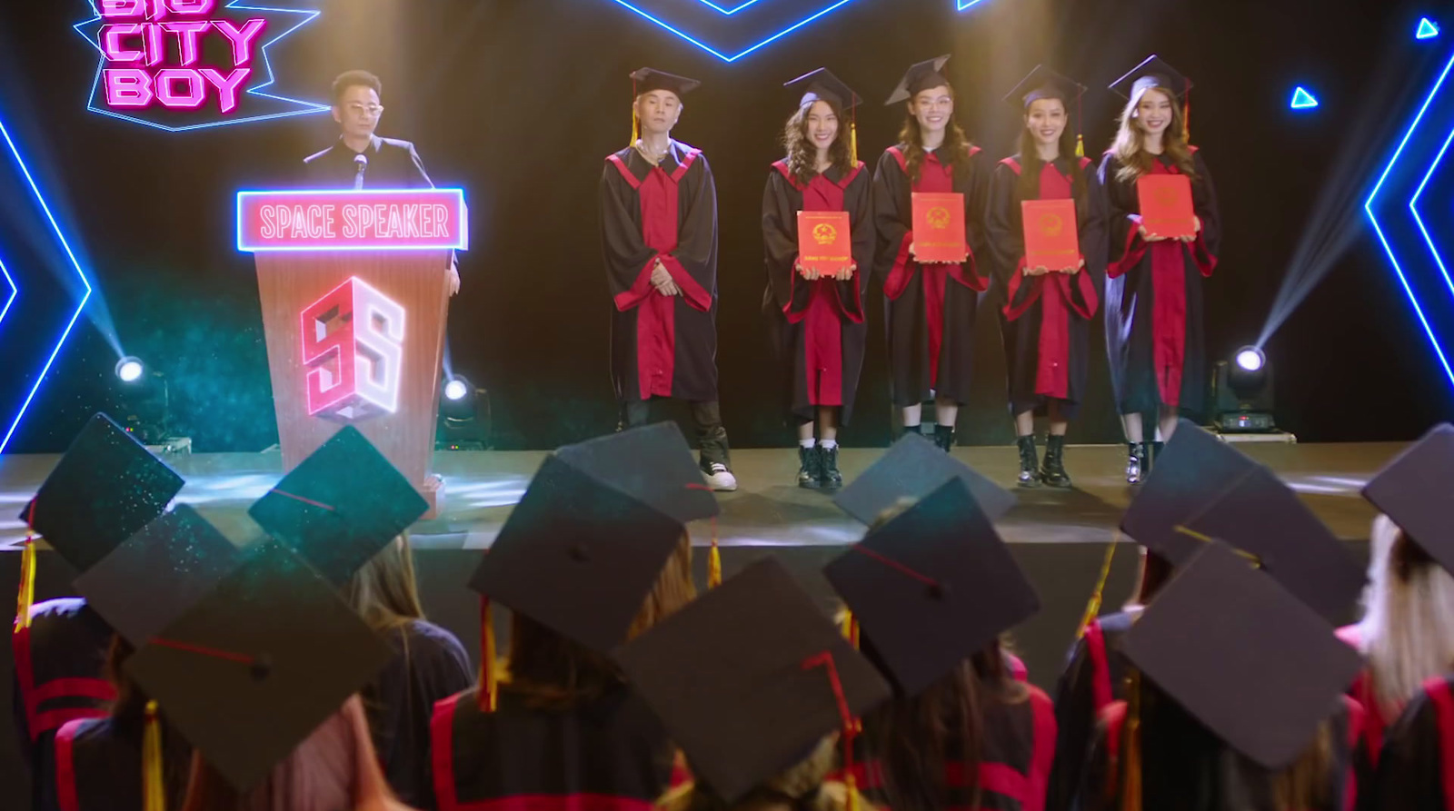 a group of young people standing on top of a stage