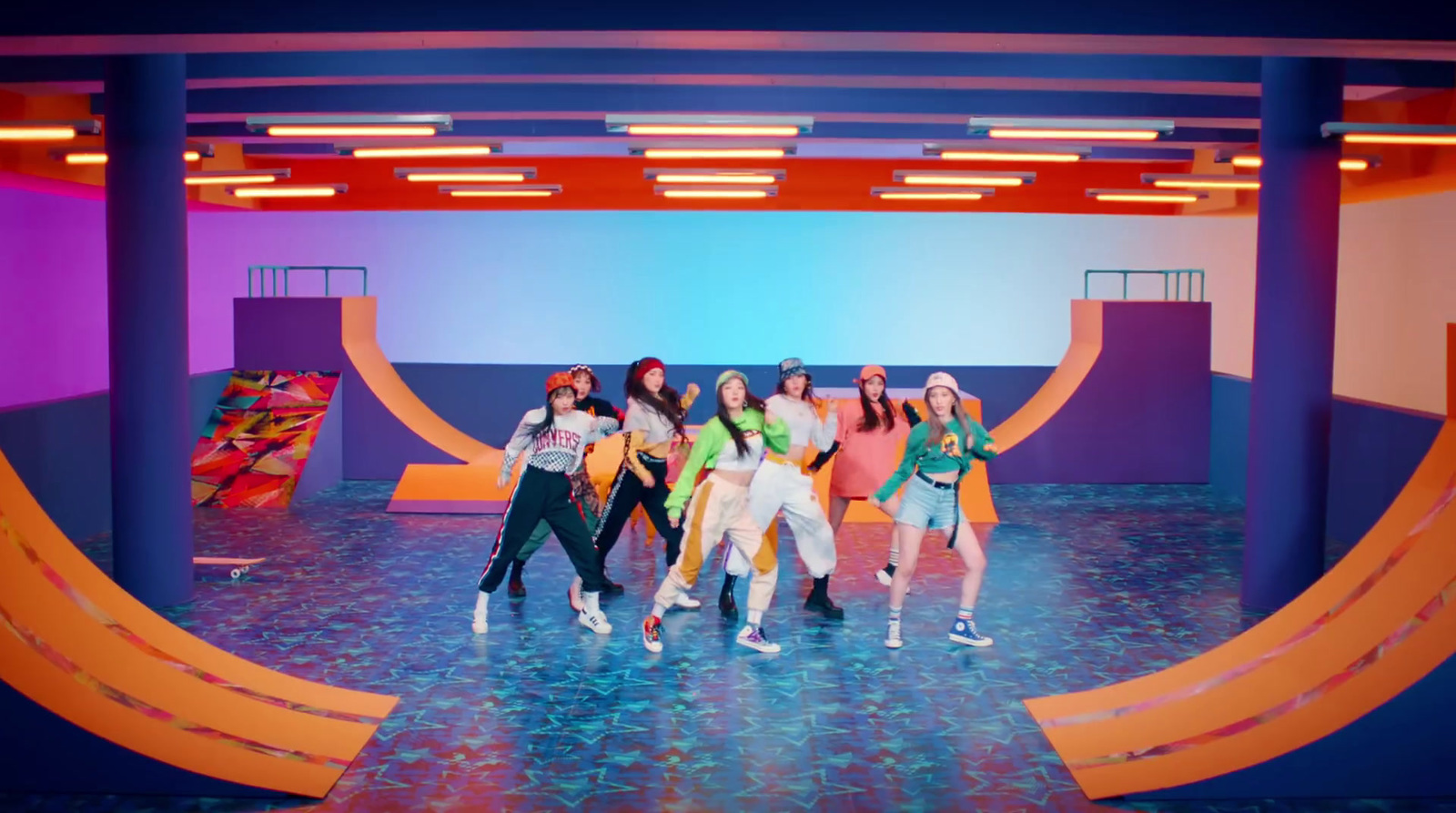 a group of girls standing on top of a stage