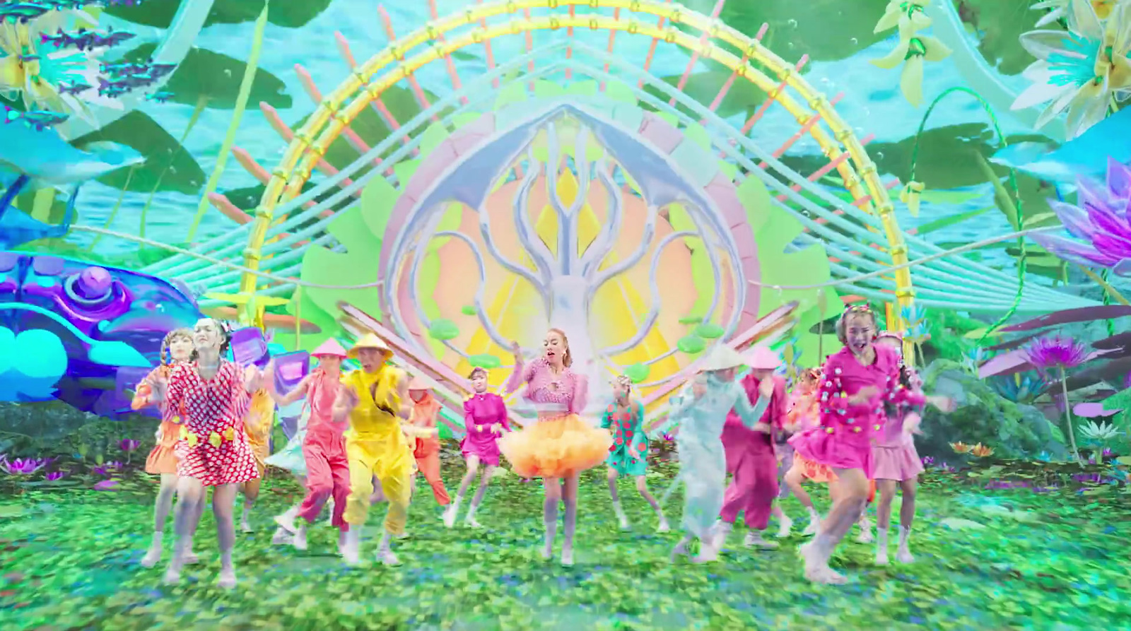 a group of people standing on top of a lush green field