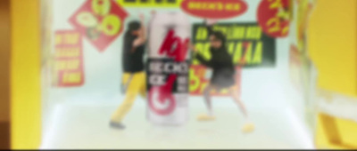 a blurry photo of two women standing in front of a sign