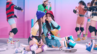 a group of young women sitting on top of a floor