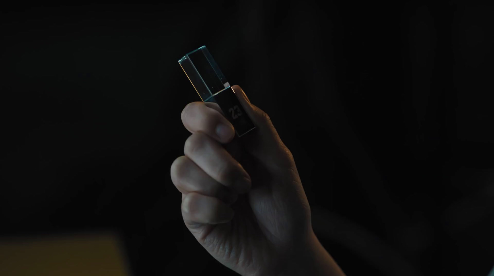 a person holding a lighter in their hand