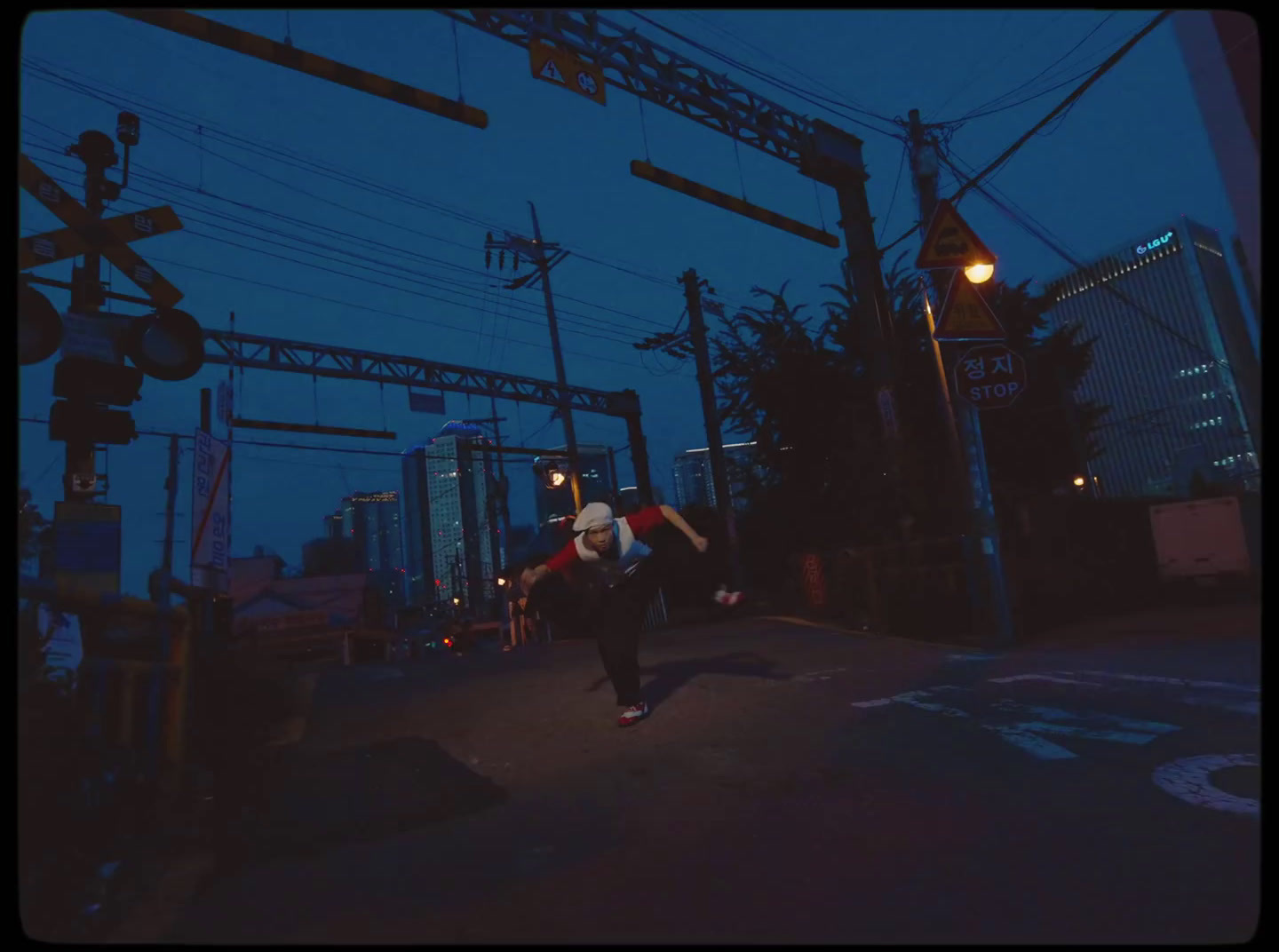 a person walking down a street at night